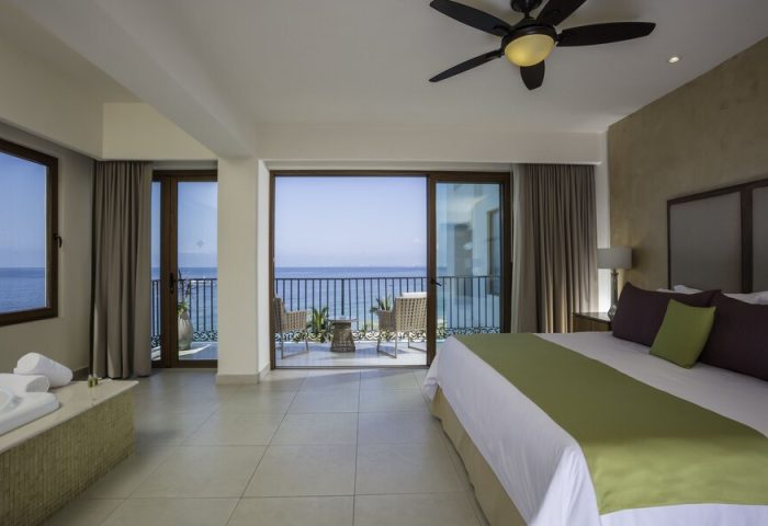 Almar Resort LGBT beachfront adults-only experience: Ocean view suite with balcony. Gay-friendly hotel room with king bed and jacuzzi.