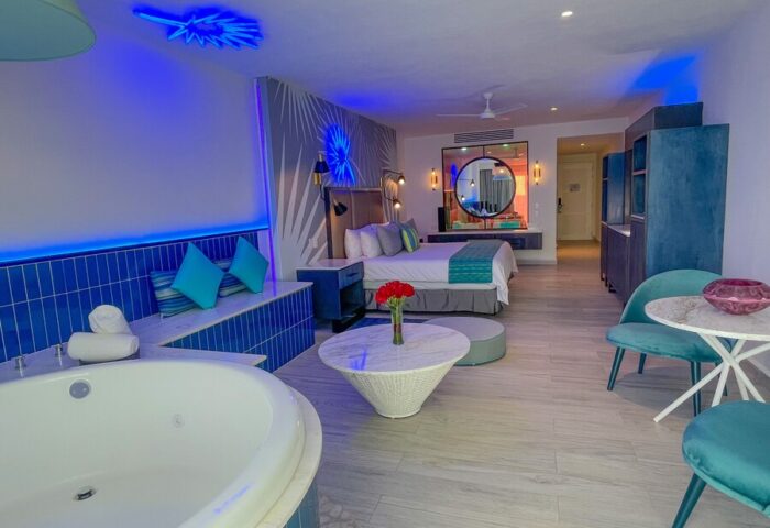Almar Resort LGBT luxury suite with jacuzzi, bed, and stylish decor. Gay-friendly, adults-only beach front experience.