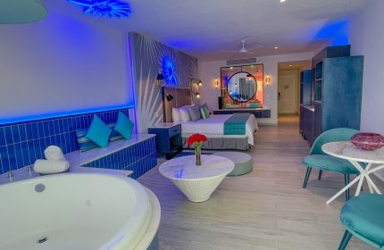 Almar Resort LGBT luxury suite with jacuzzi, bed, and stylish decor. Gay-friendly, adults-only beach front experience.
