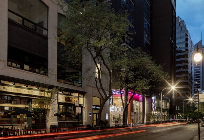 Aloft Chicago Mag Mile, a gay-friendly hotel. Street view at dusk with light trails. Great location for gay travelers in Chicago.