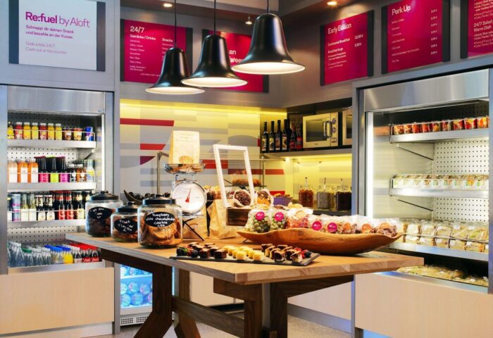 Aloft Munich's Refuel station, a gay-friendly hotel amenity. Snacks, drinks, and treats are available 24/7. Perfect for gay travelers.