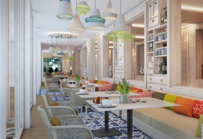 Amari Koh Samui's gay-friendly hotel restaurant. Stylish seating, colorful decor, and unique lighting create a welcoming ambiance.
