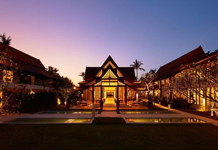 Amari Koh Samui gay-friendly hotel exterior at dusk. Thai architecture, pools, and tropical landscaping. Ideal for gay men's travel in Koh Samui.