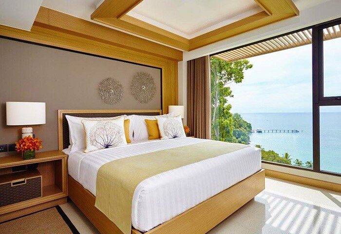 Amari Phuket gay-friendly hotel SHA-certified bedroom. King bed with ocean view. Thailand travel for gay men.