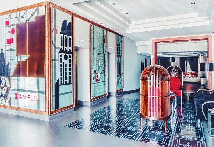 Amelie Hotel Manila lobby. Gay-friendly hotel with modern design, artistic glass panels, and unique cage-like seating. Great for gay travelers.