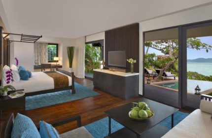Anantara Bophut Koh Samui Resort gay-friendly hotel room. Bedroom, living area, and ocean view. Luxurious travel for gay men.