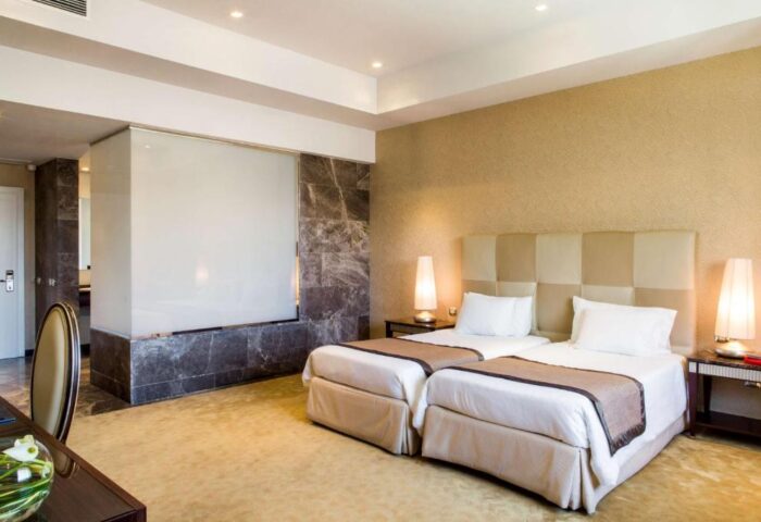 Anantara New York Palace Budapest room with twin beds. Gay-friendly, pet-friendly hotel. Luxury travel for gay men.