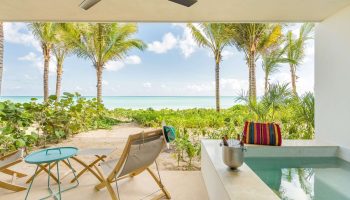 Andaz Mayakoba Resort Riviera Maya, a gay-friendly hotel by Hyatt. Ocean view from a suite's patio with chairs, plunge pool, and chilled drinks.