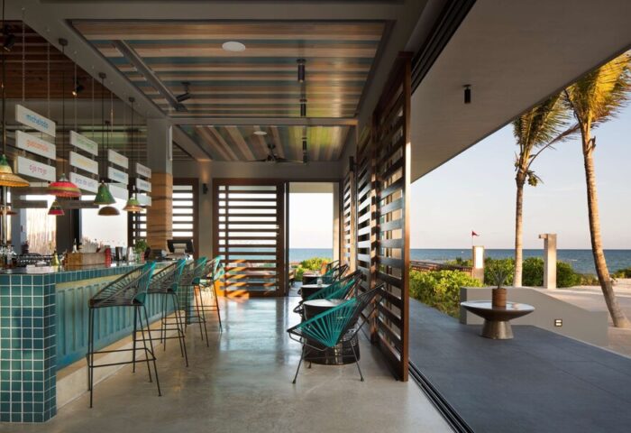 Gay-Friendly Andaz Mayakoba Resort Riviera Maya bar area. Ocean view, stylish design, and relaxed atmosphere. Perfect for gay travelers.