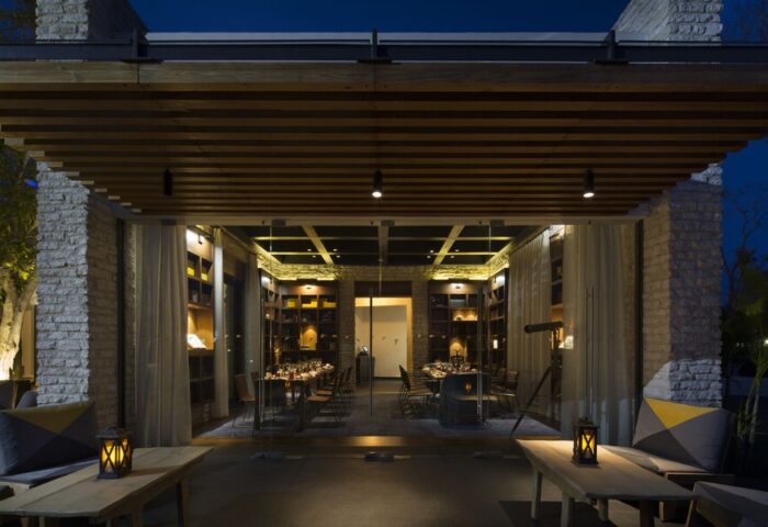 Gay-Friendly Andaz Mayakoba Resort Riviera Maya, By Hyatt. Restaurant interior with tables set for dinner. Elegant, upscale dining.
