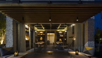 Gay-Friendly Andaz Mayakoba Resort Riviera Maya, By Hyatt. Restaurant interior with tables set for dinner. Elegant, upscale dining.