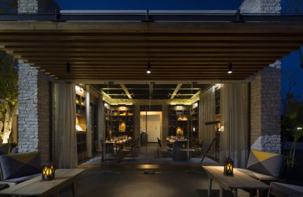 Gay-Friendly Andaz Mayakoba Resort Riviera Maya, By Hyatt. Restaurant interior with tables set for dinner. Elegant, upscale dining.
