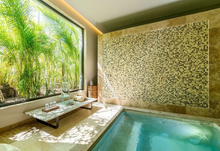 Andaz Mayakoba Resort Riviera Maya, By Hyatt: Gay-friendly hotel bathroom with a soaking tub and a view of lush greenery.