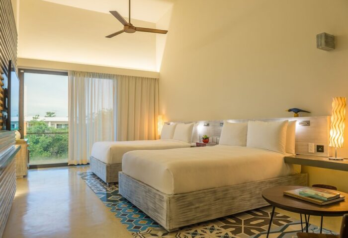 Gay-Friendly Andaz Mayakoba Resort Riviera Maya By Hyatt: Room with two beds, ceiling fan, balcony, and colorful floor tiles.