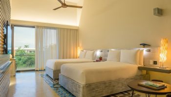 Gay-Friendly Andaz Mayakoba Resort Riviera Maya By Hyatt: Room with two beds, ceiling fan, balcony, and colorful floor tiles.
