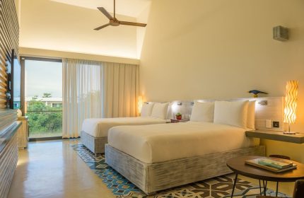 Gay-Friendly Andaz Mayakoba Resort Riviera Maya By Hyatt: Room with two beds, ceiling fan, balcony, and colorful floor tiles.