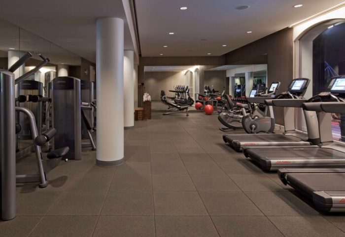 Andaz West Hollywood gay-friendly hotel gym. Treadmills, weights, and exercise equipment in a modern fitness center. Travel advice for gay men.