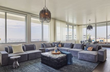 Andaz West Hollywood's gay-friendly hotel suite. Modern living room with city views, stylish furniture, and luxury amenities for gay travelers.
