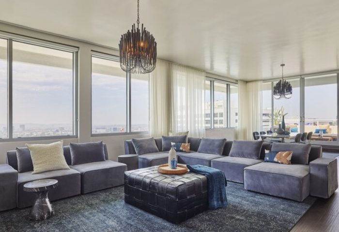 Andaz West Hollywood's gay-friendly hotel suite. Modern living room with city views, stylish furniture, and luxury amenities for gay travelers.