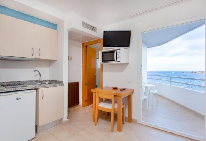 Gay-Friendly Apartamentos Mar y Playa: Kitchenette with sea view balcony. Ideal gay travel hotel for beach holidays.