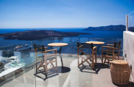 Aperto Suites Adults Only gay-friendly hotel balcony view. Tables and chairs overlook the sea. Ideal for gay men's travel.