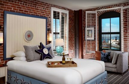Argonaut Hotel room, gay-friendly lodging. Brick walls, nautical decor, and harbor view. Perfect for gay men's travel. #SanFrancisco #hotel