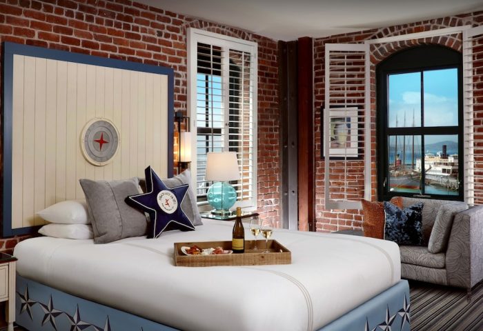 Argonaut Hotel room, gay-friendly lodging. Brick walls, nautical decor, and harbor view. Perfect for gay men's travel. #SanFrancisco #hotel