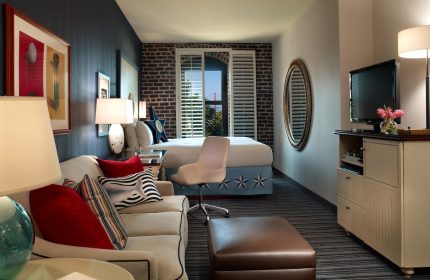 Gay-friendly Argonaut Hotel room. Stylish interior with nautical theme. Comfortable seating area and view. Great choice for gay travel.