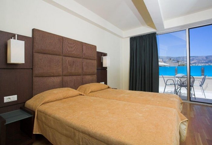 Arion Athens Hotel gay-friendly room. Twin beds, balcony with sea view. A comfortable stay in Athens for gay travelers.