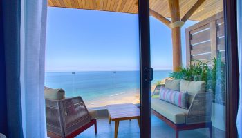 Armony Resort & Spa adults-only suite balcony view. Oceanfront, gay-friendly hotel in Punta de Mita, Mexico. All-inclusive luxury travel.