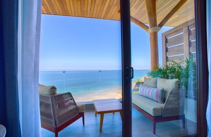 Armony Resort & Spa adults-only suite balcony view. Oceanfront, gay-friendly hotel in Punta de Mita, Mexico. All-inclusive luxury travel.
