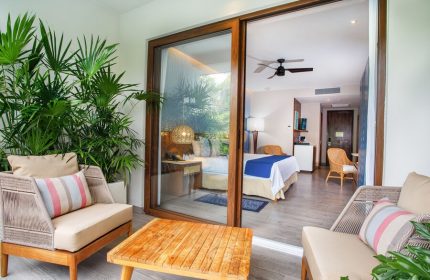 Armony Resort & Spa All Inclusive Adults Only future MGallery gay-friendly hotel room with balcony, seating area, and view of the bedroom.