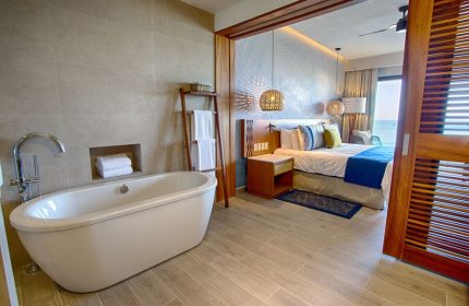 Armony Resort & Spa All Inclusive Adults Only MGallery gay-friendly hotel room. Bathtub, bedroom, and ocean view. Luxury travel.
