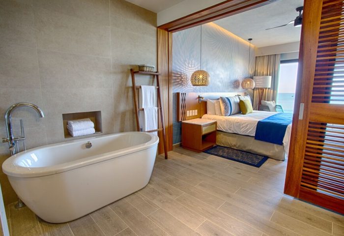 Armony Resort & Spa All Inclusive Adults Only MGallery gay-friendly hotel room. Bathtub, bedroom, and ocean view. Luxury travel.
