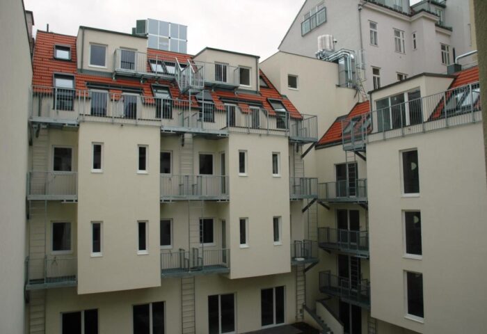 Arthotel ANA Boutique Six: Multi-story building exterior with balconies and fire escapes. A gay-friendly hotel for gay men travel.