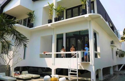 Arthur&Paul Men Only Hotel exterior. Gay-friendly hotel with modern design, balcony, spiral staircase, and lounge chairs. Ideal for gay travel.