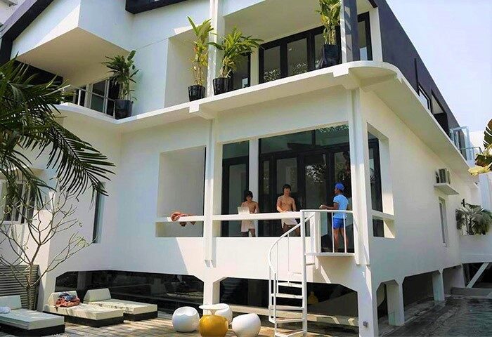 Arthur&Paul Men Only Hotel exterior. Gay-friendly hotel with modern design, balcony, spiral staircase, and lounge chairs. Ideal for gay travel.