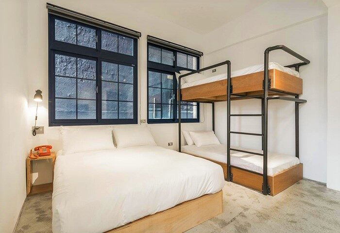 Art'otel Ximending Taipei room. Gay-friendly hotel with a double bed and bunk beds. Modern design, perfect for gay travelers.