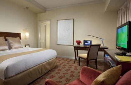Ascott Makati gay-friendly hotel room. Bedroom with bed, desk, and TV. A comfortable and inviting space for gay travelers in Makati.