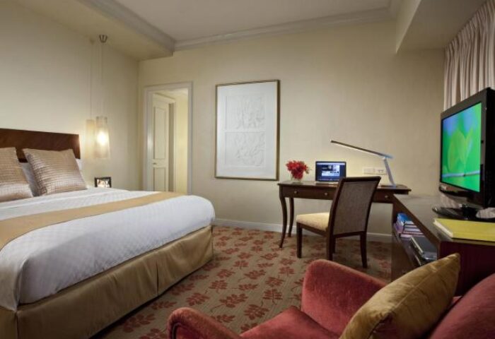 Ascott Makati gay-friendly hotel room. Bedroom with bed, desk, and TV. A comfortable and inviting space for gay travelers in Makati.