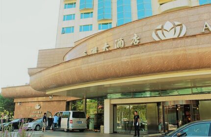 Asia Hotel entrance. A gay-friendly hotel in Asia with modern architecture, car service, and doorman. Perfect for gay men travel in Asia.