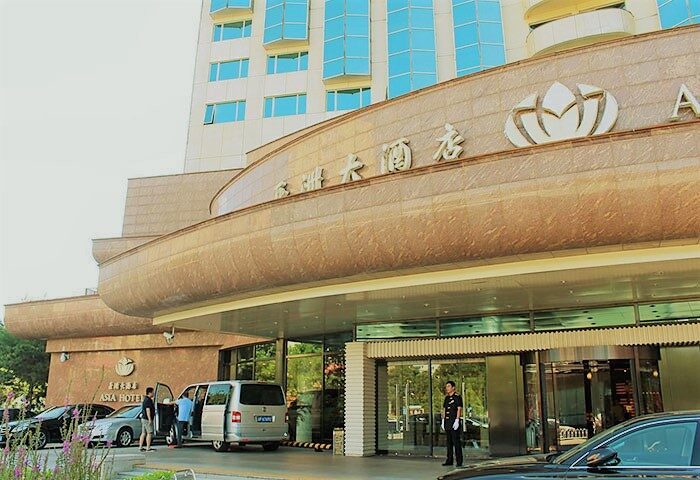 Asia Hotel entrance. A gay-friendly hotel in Asia with modern architecture, car service, and doorman. Perfect for gay men travel in Asia.