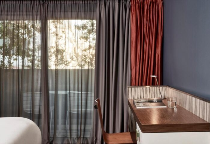 AthensWas Hotel room detail. Desk, chair, and balcony view. Gay-friendly hotel in Athens, Greece for gay men's travel. Modern design.