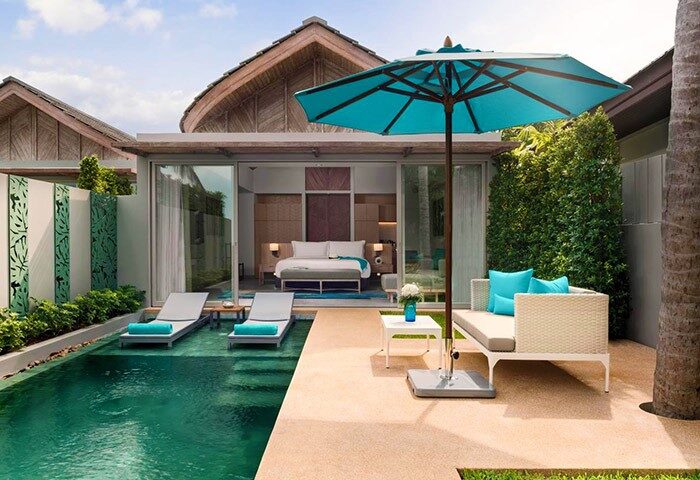 Avani+ Samui Resort: Gay-friendly hotel with private pool access. Luxurious villa with sun loungers, umbrella, and a view of the bedroom.