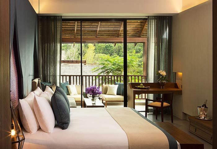 Avista Hideaway Phuket Patong MGallery by Sofitel room. Balcony view, desk, and bed. Gay-friendly hotel for gay men travel in Phuket.