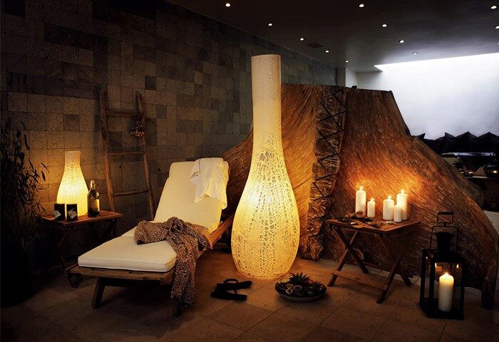 Gay-Friendly Hotel Axel Guldsmeden spa area. Relaxing lounge chair, candles, and ambient lighting create a serene atmosphere for gay travelers.