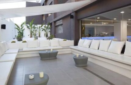 AxelBeach Ibiza Suites Adults-Only gay-friendly hotel lounge area. Stylish apartments, spa, beach club for gay men's travel.
