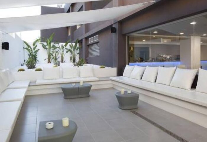 AxelBeach Ibiza Suites Adults-Only gay-friendly hotel lounge area. Stylish apartments, spa, beach club for gay men's travel.