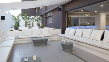 AxelBeach Ibiza Suites Adults-Only gay-friendly hotel lounge area. Stylish apartments, spa, beach club for gay men's travel.