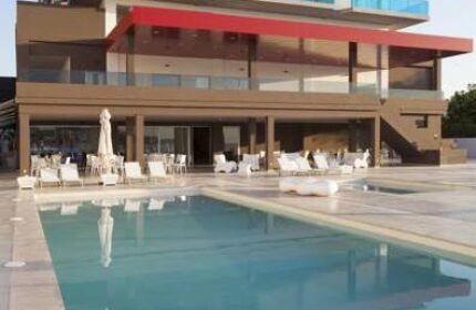 AxelBeach Ibiza Suites Apartments pool. Gay-friendly, adults-only hotel with spa and beach club. Modern architecture.